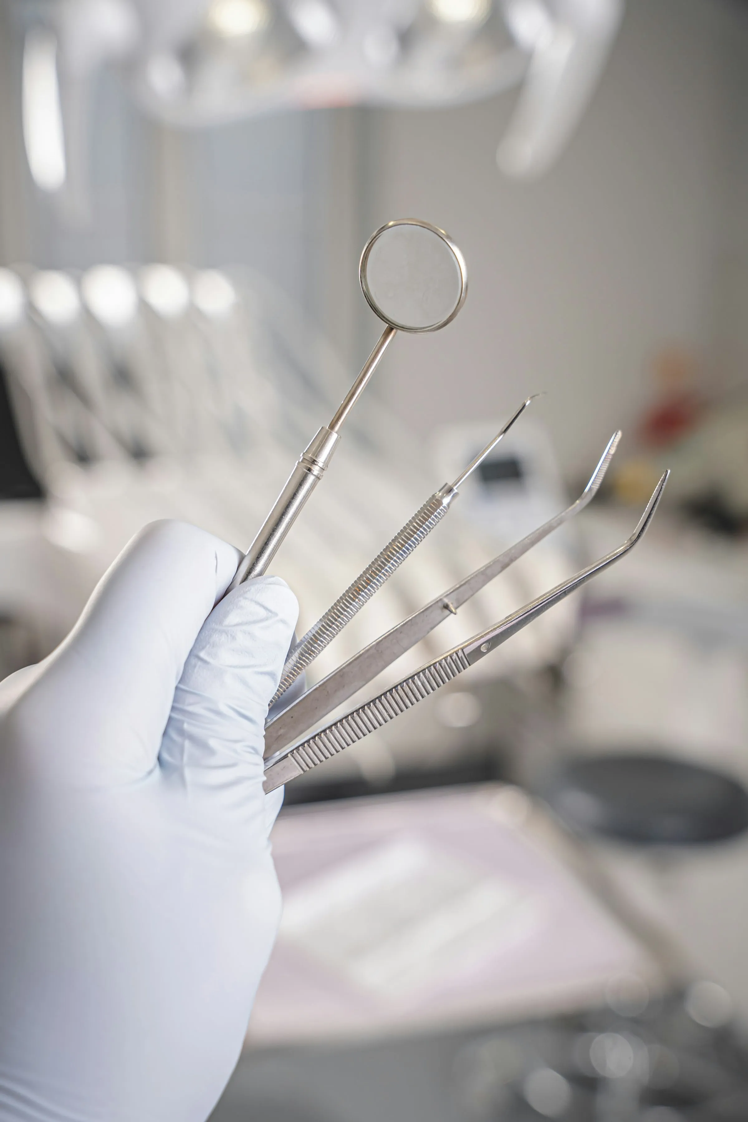 Dental instruments in a gloved hand