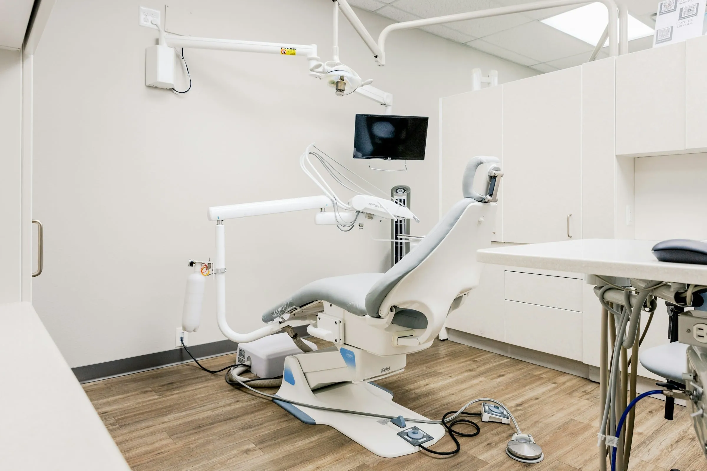 Bright treatment room with a dental chair